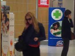 Photo of Justine Sacco in an airport holding her phone up to her ear.